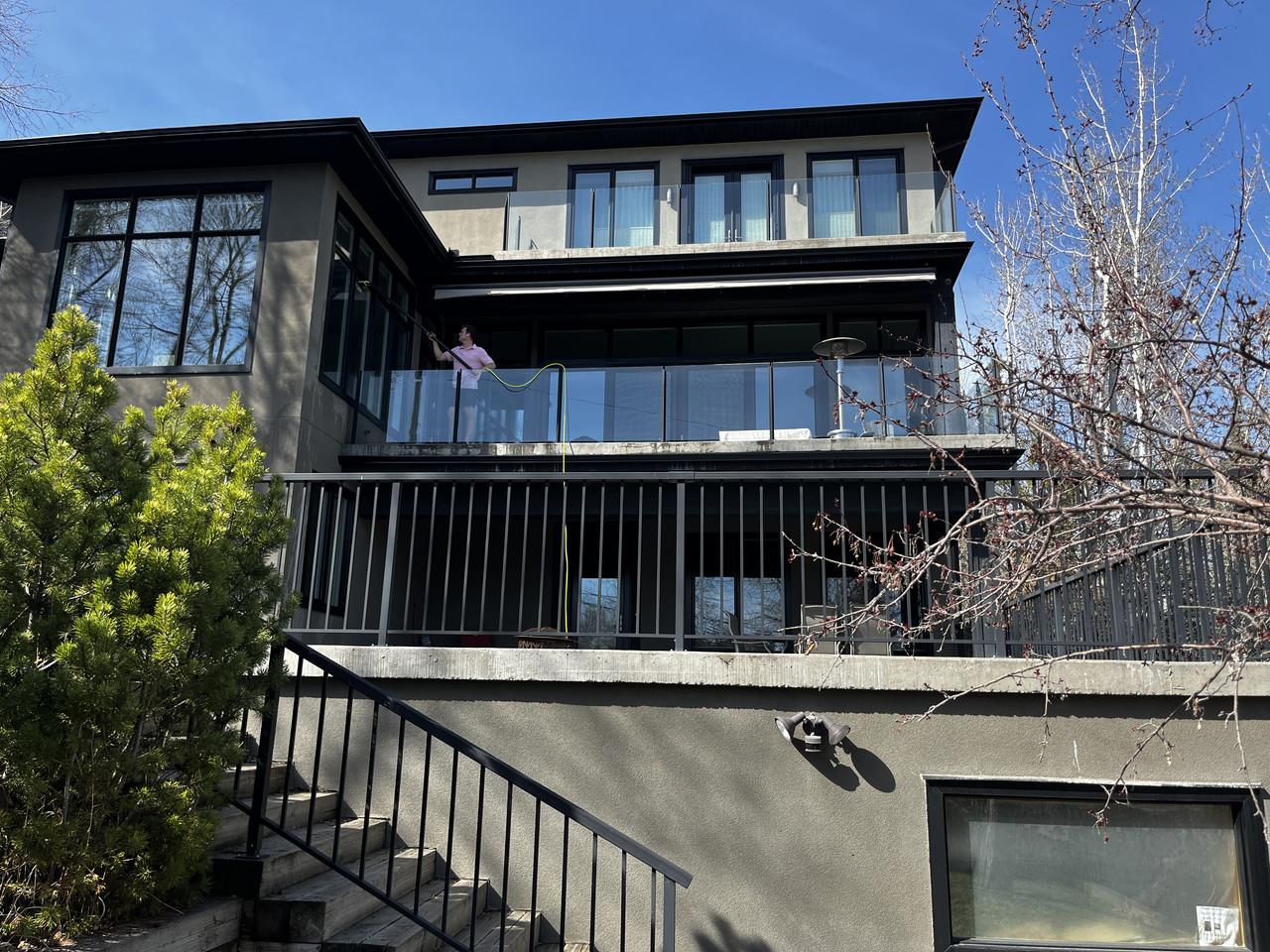Custom home exterior windows cleaned by Clarity Co. in Calgary