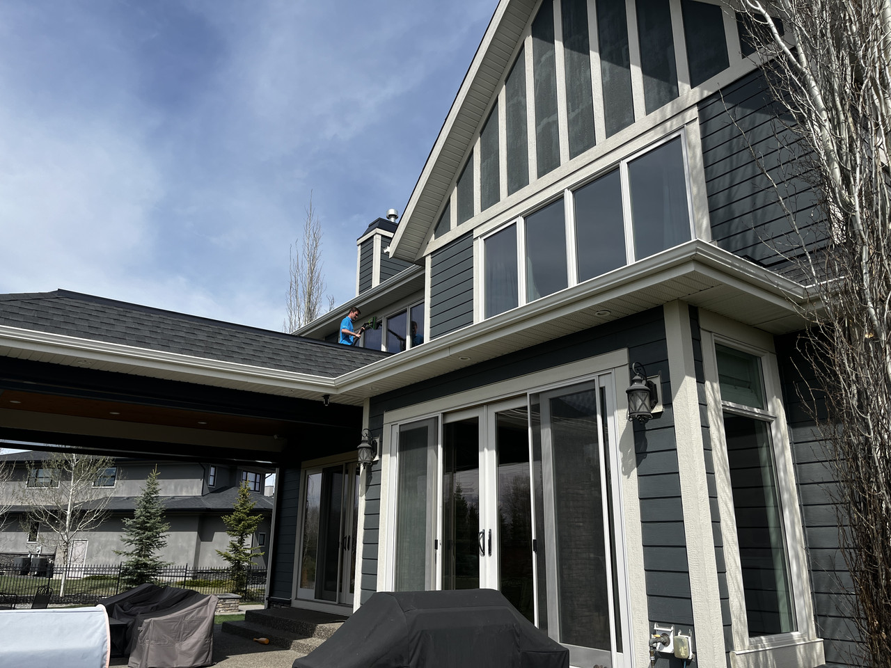 Custom home exterior windows cleaned by Clarity Co. in Calgary