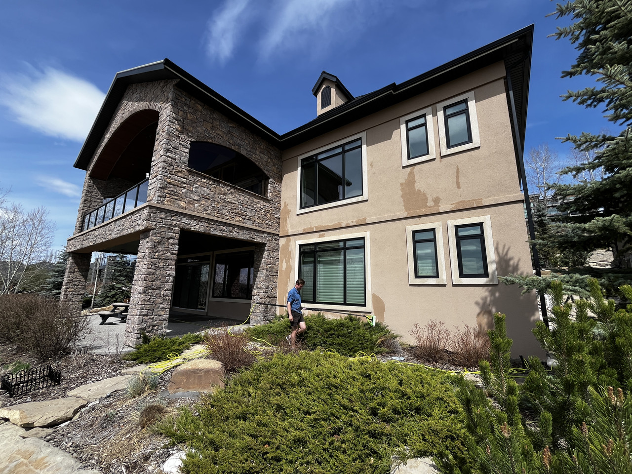 Custom home exterior windows cleaned by Clarity Co. in Calgary